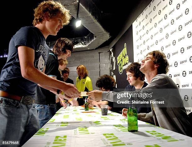 Liam Fray, Michael Campbell, Daniel Conan Moores and Mark Cuppello of The Courteeners sign for fans at Zavvi on June 23, 2008 in Manchester, England.