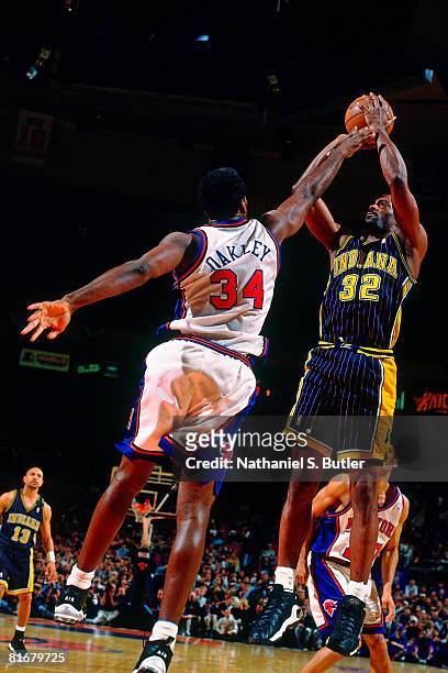 Dale Davis of the Indiana Pacers shoots a jump shot over Charles Oakley of the New York Knicks in Game Four of the Eastern Conference Semifinals...