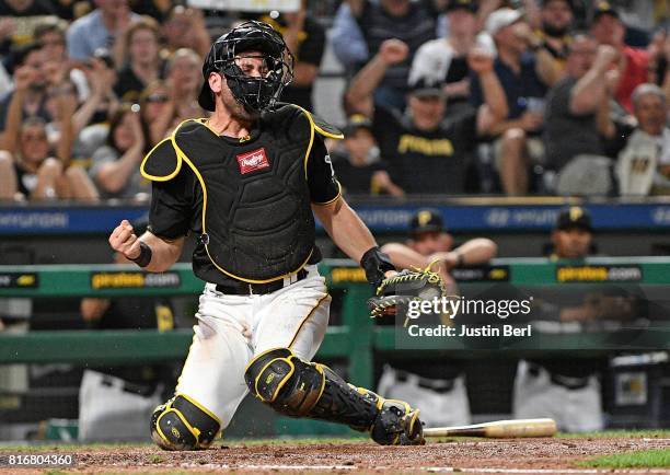 Francisco Cervelli of the Pittsburgh Pirates reacts after tagging out Manny Pina of the Milwaukee Brewers at home plate in the sixth inning during...