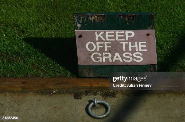 Keep off the grass sign on day two of the Wimbledon Lawn Tennis Championships at the All England Lawn Tennis and Croquet Club on June 24, 2008 in...