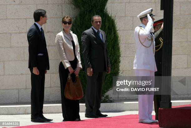 French First Lady Carla Bruni-Sarkozy attends a welcoming ceremony for her and her husband, French President Nicolas Sarkozy at Palestinian president...