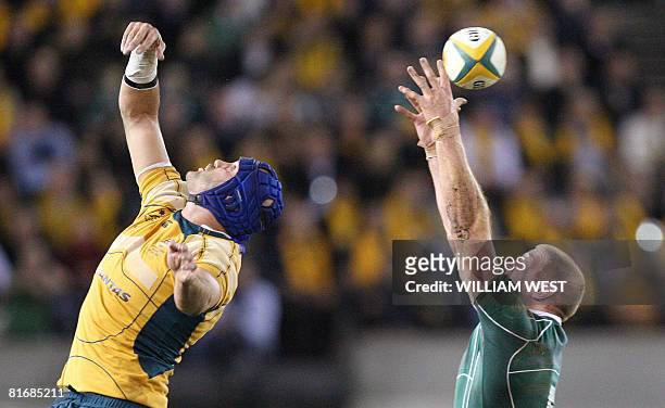 Ireland's Paul O'Connell takes in the line-out ball ahead of Australia's James Horwill during their Test match being played at the Docklands Stadium...