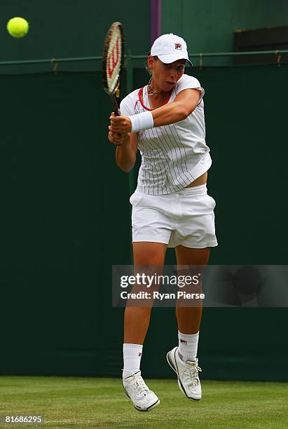 Marina Erakovic of New Zealand plays a backhand during the women's singles round one match against Michaella Krajicek of Netherlands on day two of...