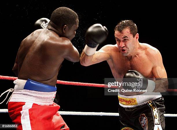 Jeff Fenech and Azumah Nelson exchanges blows during their welterweight fight at the Vodafone Arena on June 24, 2008 in Melbourne, Australia.