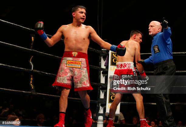 Omar Figueroa Jr., right, is sent to a neutral corner after knocking down Robert Guerrero during the second round of their Welterweight fight at...