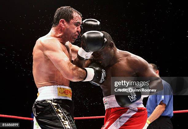 Jeff Fenech and Azumah Nelson exchanges blows during their welterweight fight at the Vodafone Arena on June 24, 2008 in Melbourne, Australia.