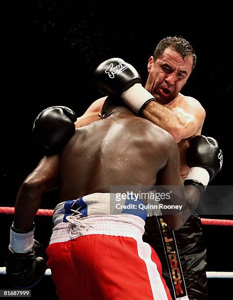 Jeff Fenech and Azumah Nelson exchanges blows during their welterweight fight at the Vodafone Arena on June 24, 2008 in Melbourne, Australia.