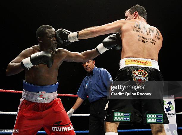 Jeff Fenech and Azumah Nelson exchanges blows during their welterweight fight at the Vodafone Arena on June 24, 2008 in Melbourne, Australia.