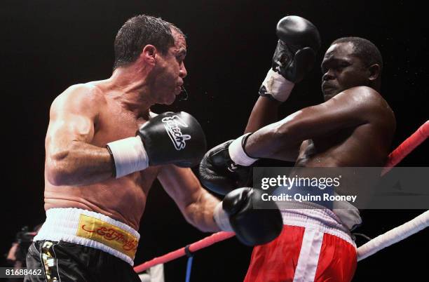 Jeff Fenech and Azumah Nelson exchanges blows during their welterweight fight at the Vodafone Arena on June 24, 2008 in Melbourne, Australia.