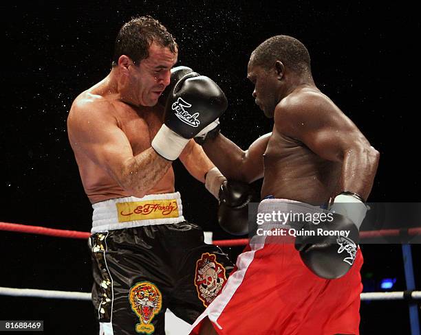 Jeff Fenech and Azumah Nelson exchanges blows during their welterweight fight at the Vodafone Arena on June 24, 2008 in Melbourne, Australia.