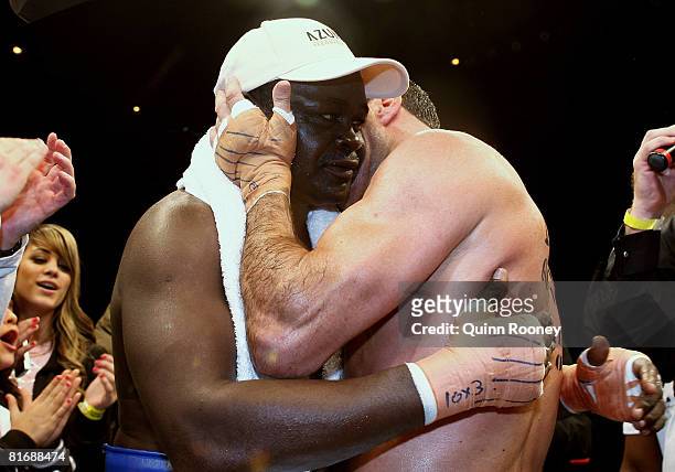 Jeff Fenech and Azumah Nelson hug after their welterweight fight at the Vodafone Arena on June 24, 2008 in Melbourne, Australia.