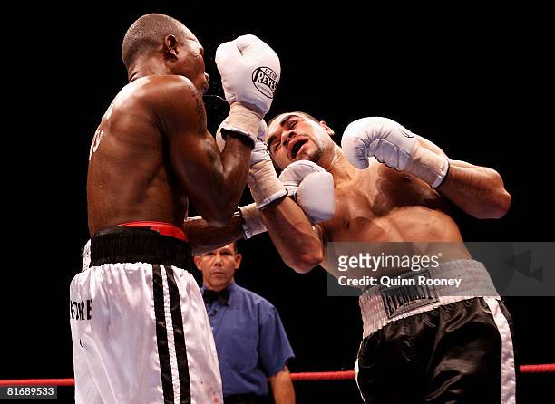 William Kickett hits Gairy St Clair in their Super Featherweight fight before the Jeff Fenech and Azumah Nelson welterweight fight at the Vodafone...
