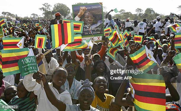 Zimbabwe's ruling party supporters attend a rally in Banket, 70 kms from Harare on June 24, 2008. President Mugabe said the elections which are...