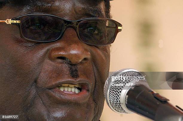 Zimbabwe's President Robert Mugabe speaks to supporters at a rally in Banket, 70 kms from Harare on June 24, 2008. President Mugabe said the...