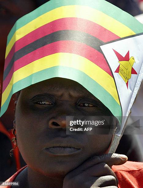 Zimbabwean suppoter of President Robert Mugabe attends a rally in Banket, 70 km from Harare on June 24, 2008. Zimbabwe's run-off election will go...