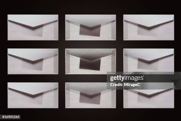privacy in illuminated envelope - dossier secret stock-fotos und bilder