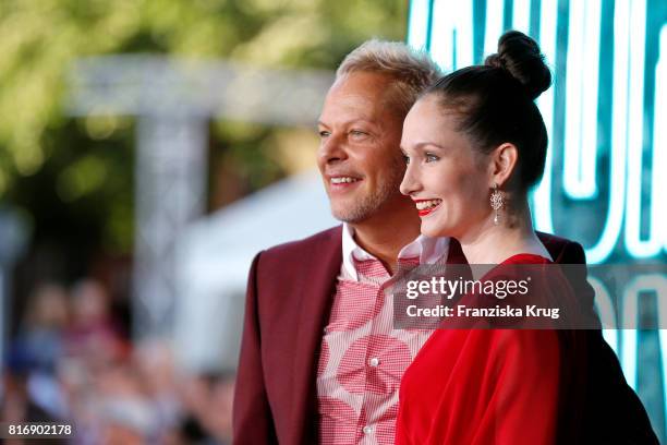 Uwe Fahrenkrog-Petersen and his partner Christin Dechant attend the 'Atomic Blonde' world premiere at Stage Theater on July 17, 2017 in Berlin,...