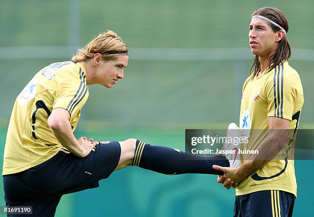 Fernando Torres of Spain exercises with his teammate Sergio Ramos during a training session at the Kampl training ground on June 24, 2008 in Neustift...