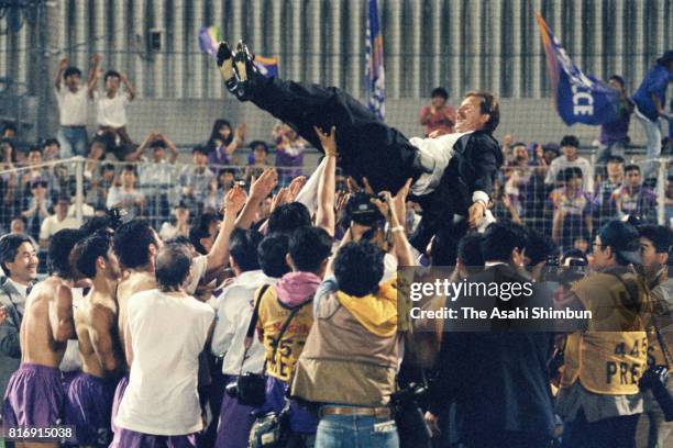 Safrecce Hiroshima head coach Stuart Baxter is tossed into the air by players as they celebrate the J.League first stage champions after the J.League...