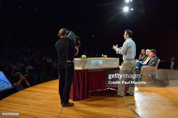 Rory MacKean competes at a Pitch-Off Session that includes judges Jeremy Conrad, Helen Greiner, Daniel Theobold and Melonee Wise at the TechCrunch...