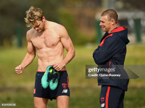 Jack Watts of the Demons speaks to head coach Simon Goodwin during a Melbourne Demons AFL training session at Gosch's Paddock on July 18, 2017 in...