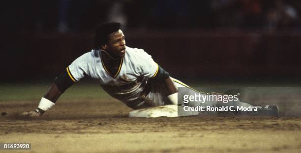 Rickey Henderson of the Oakland A's steals base during a MLB game against the Milwaukee Brewers when he broke Lou Brock's single-season stolen base...