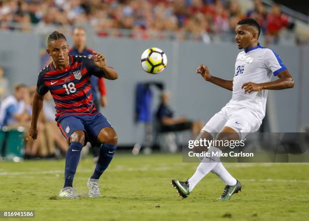 Juan Agudelo of the United States against Stephane Abaul of Martinique during the first half of the CONCACAF Group B match at Raymond James Stadium...