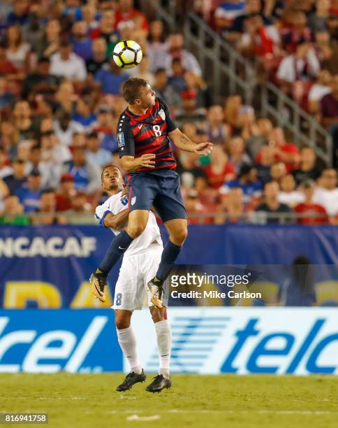 Jordan Morris of the United States heads the ball above Jordy Delem of Martinique during the second half of the CONCACAF Group B match at Raymond...