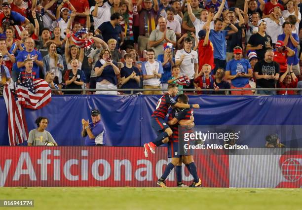 Paul Arriola, Jordan Morris and Eric Lichaj of the United States celebrate a goal against Martinique during the second half of the CONCACAF Group B...