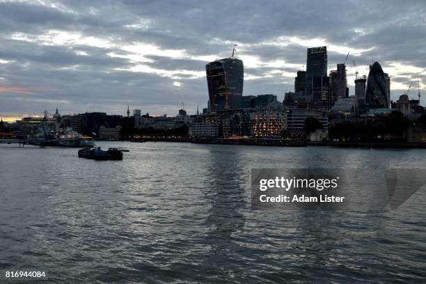 overcast city on the river - adam lister stockfoto's en -beelden