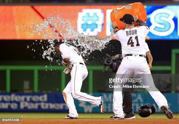 Dee Gordon of the Miami Marlins celebrates hitting a bases loaded walk off single in the 11th inning during a game against the Philadelphia Phillies...