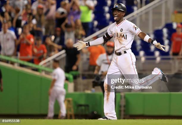 Dee Gordon of the Miami Marlins celebrates hitting a bases loaded walk off single in the 11th inning during a game against the Philadelphia Phillies...