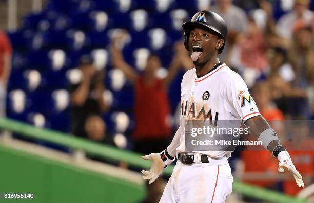 Dee Gordon of the Miami Marlins celebrates hitting a bases loaded walk off single in the 11th inning during a game against the Philadelphia Phillies...