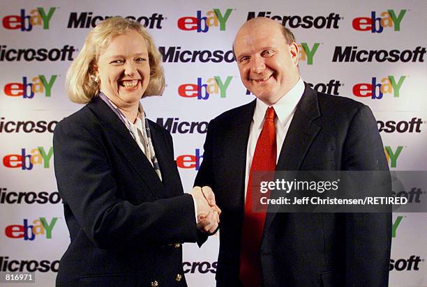 Steve Ballmer, right, the CEO of Microsoft, and Meg Whitman, President and CEO of eBay Inc., shake hands March 12, 2001 in San Jose, California after...