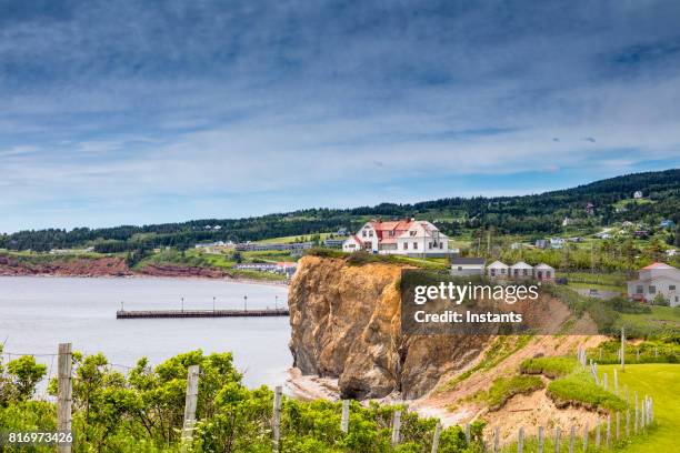 a look at houses in percé, part of the gaspé peninsula in québec. - gaspe peninsula stock pictures, royalty-free photos & images