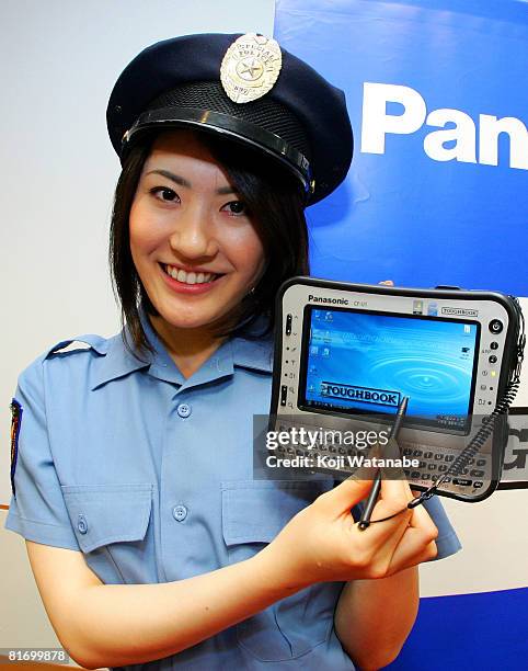 Model holds Matsushita Co Ltd's Panasonic new notebook computer "Toughbook CF-U1" at World Trade Center Building on June 25, 2008 in Tokyo, Japan....