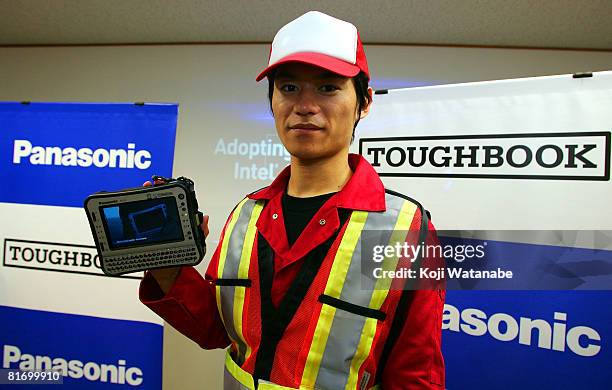 Model holds Matsushita Co Ltd's Panasonic new notebook computer "Toughbook CF-U1" at World Trade Center Building on June 25, 2008 in Tokyo, Japan....