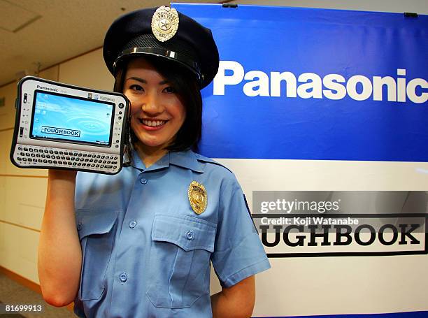 Model holds Matsushita Co Ltd's Panasonic new notebook computer "Toughbook CF-U1" at World Trade Center Building on June 25, 2008 in Tokyo, Japan....