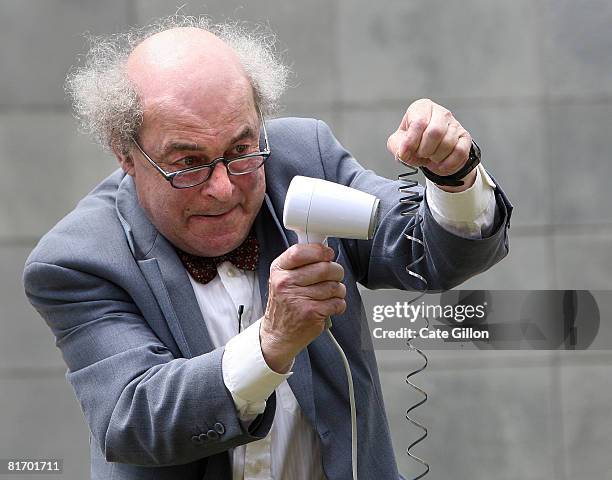 Inventor and broadcaster Professor Heinz Wolff performs a science show for children from local schools in the Paddington area, who were celebrating...