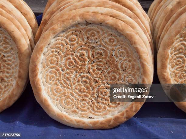 traditional uyghur bread naan in kashgar city in western china - naan stock pictures, royalty-free photos & images