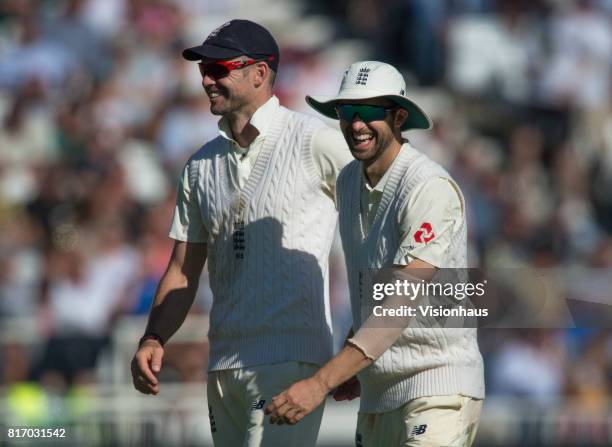 Jimmyu Anderson and Mark Wood of England share a joke during the third day of the second test between England and South Africa at Trent Bridge on...