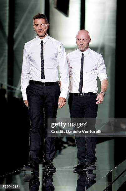 Designers Stefano Gabbana and Domenico Dolce acknowledge the applause of the audience after the Dolce & Gabbana fashion show as part of Milan Fashion...