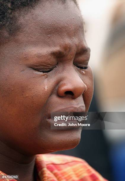 Mourner grieves at the funeral of Abigail Chitoro, the wife of a prominent opposition party member, June 25, 2008 in Harare, Zimbabwe. Chitoro was...