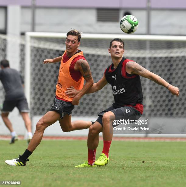 Mesut Ozil and Granit Xhaka of Arsenal during an Arsenal Training Session at Yuanshen Sports Centre Stadium on July 18, 2017 in Shanghai, China.