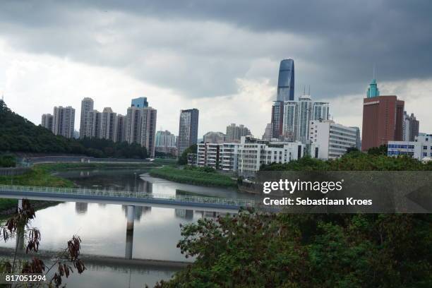 urban skyline of shenzhen seen from hong kong border at lowu, china - lowu stock pictures, royalty-free photos & images