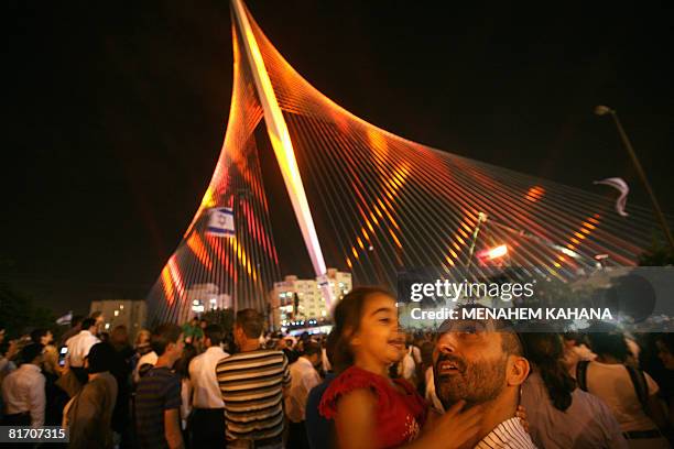 Israelis participate in the inauguration ceremony of the 'Chords Bridge' , designed by Spanish architect Santiago Calatrava, at the main entrance of...