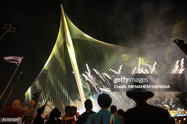 Israelis participate in the inauguration ceremony of the 'Chords Bridge' , designed by Spanish architect Santiago Calatrava, at the main entrance of...