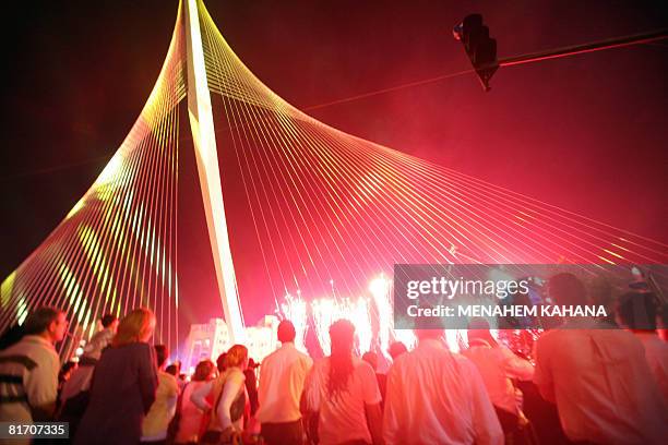 Israelis participate in the inauguration ceremony of the 'Chords Bridge' , designed by Spanish architect Santiago Calatrava, at the main entrance of...
