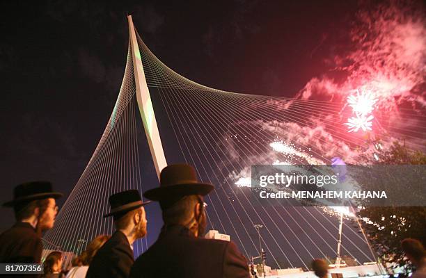 Ultra-Orthodox Jews watch fireworks during the inauguration ceremony of the 'Chords Bridge' , designed by Spanish architect Santiago Calatrava, at...