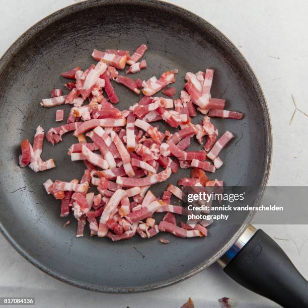 lardons in a cooking pan. - lardon stock stock pictures, royalty-free photos & images